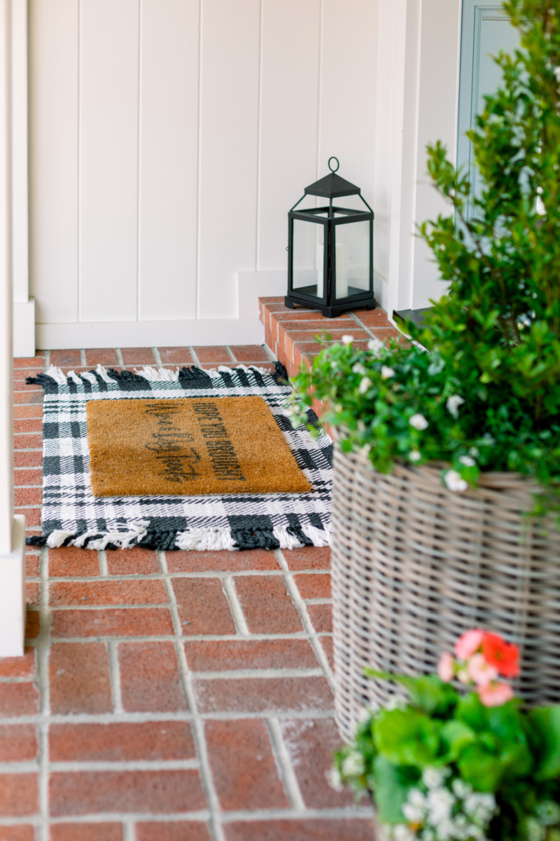 Front porch with layered doormat