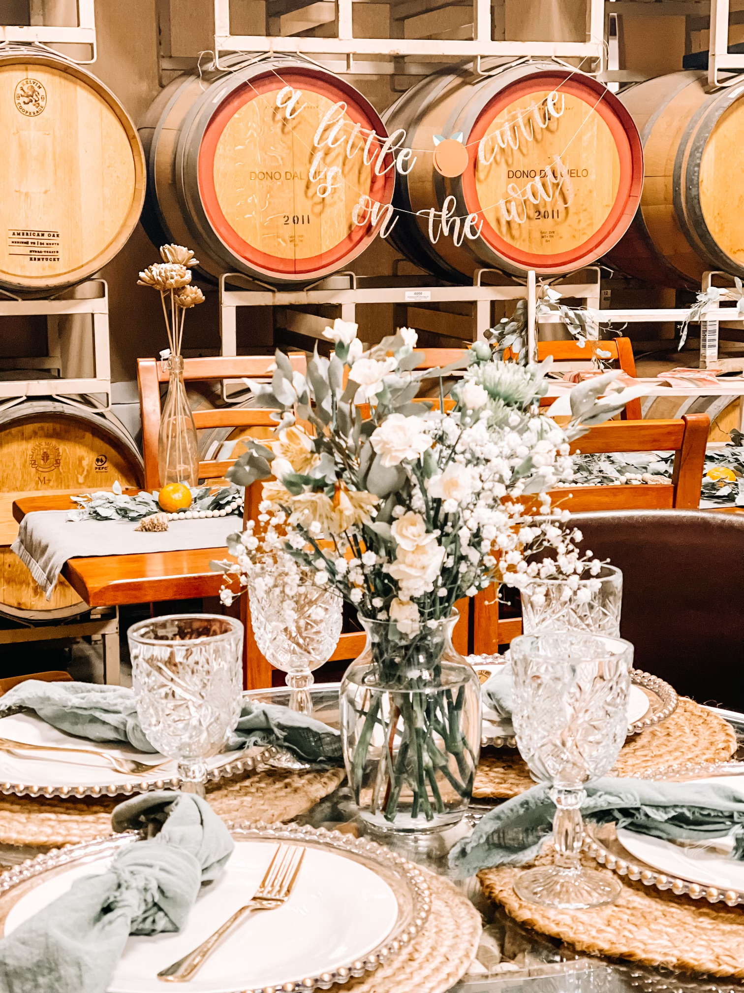 Table setting in winery barrel room