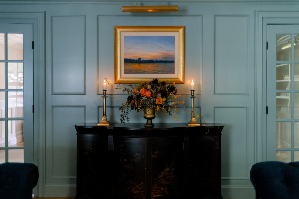 Console table with art and flowers