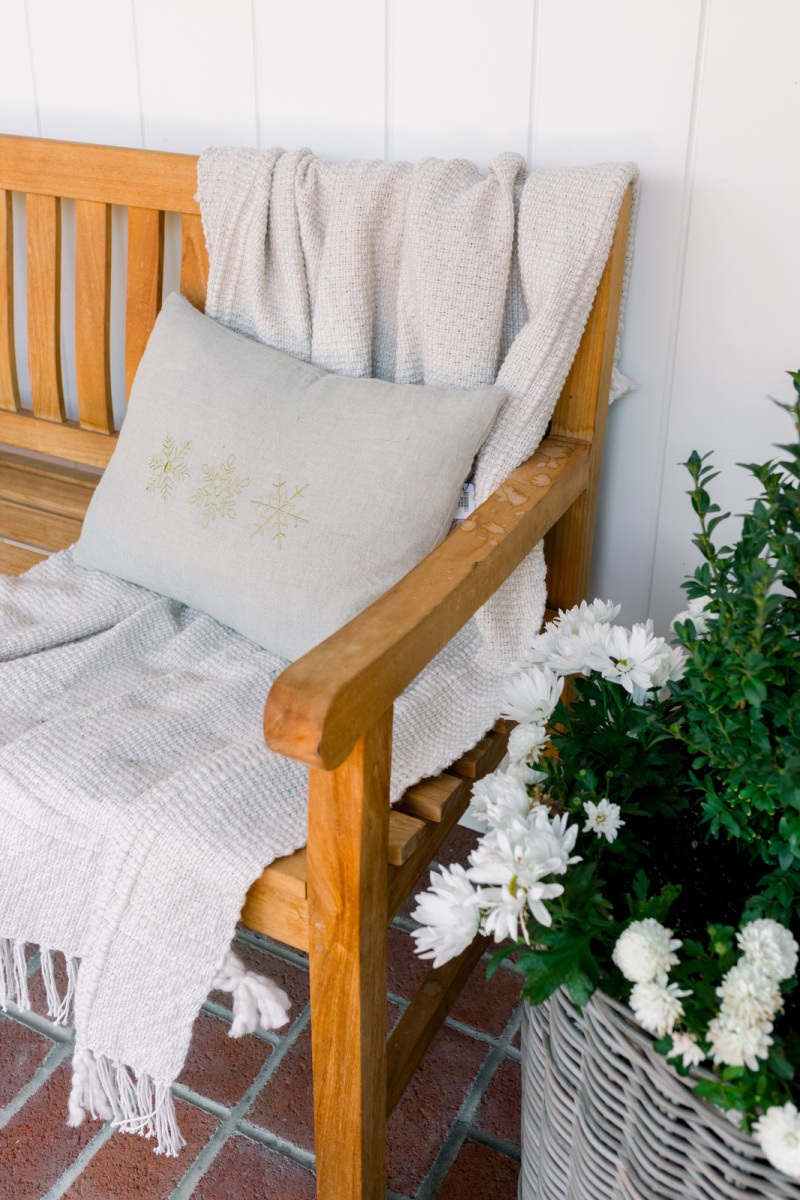 Close up on bench with holiday pillow