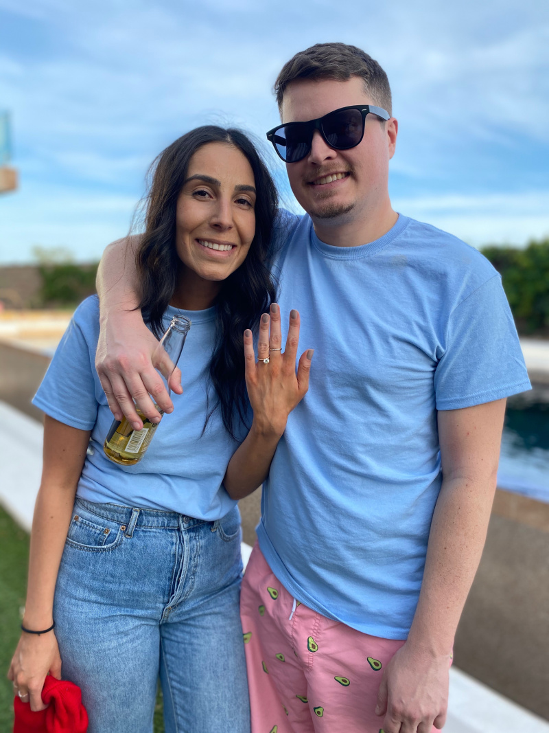Newly engaged couple with engagement ring