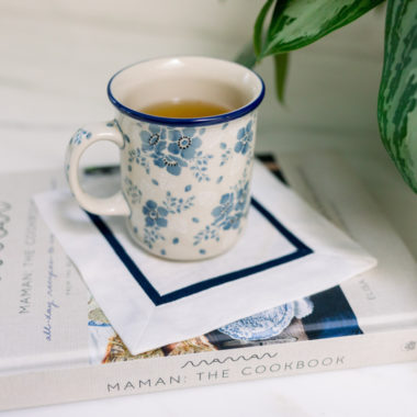 Maman Cookbook with Blue and White Mug on Top