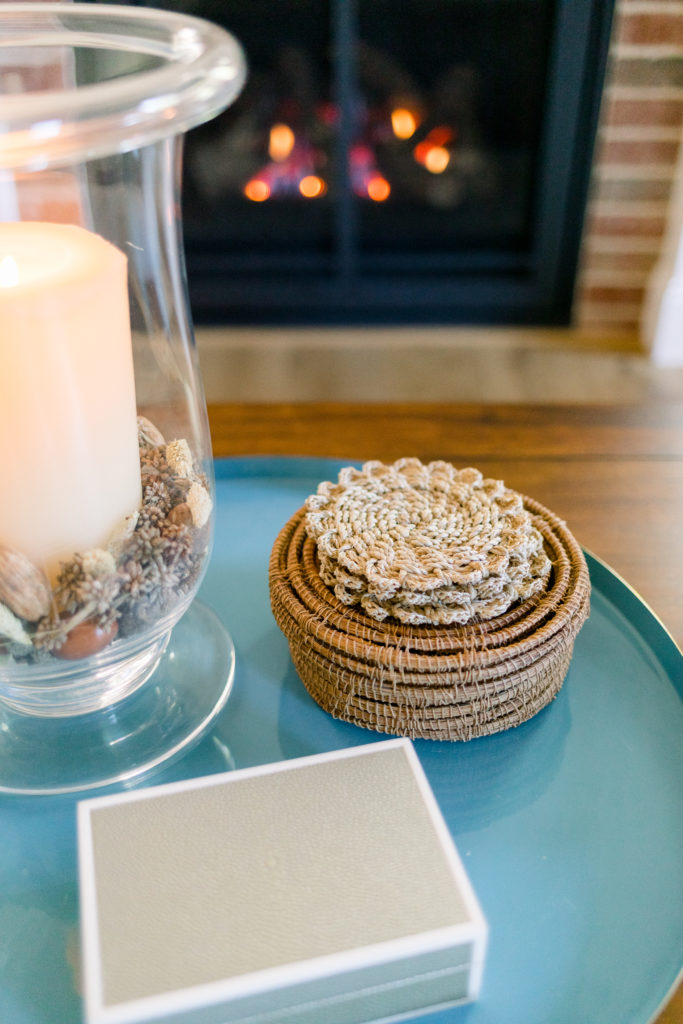 Coffee table tray in front of fire with natural coasters