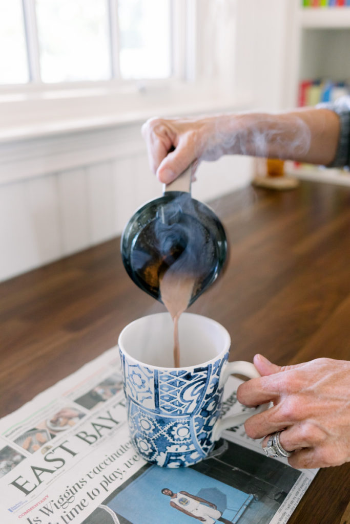 Pouring cocoa into mug