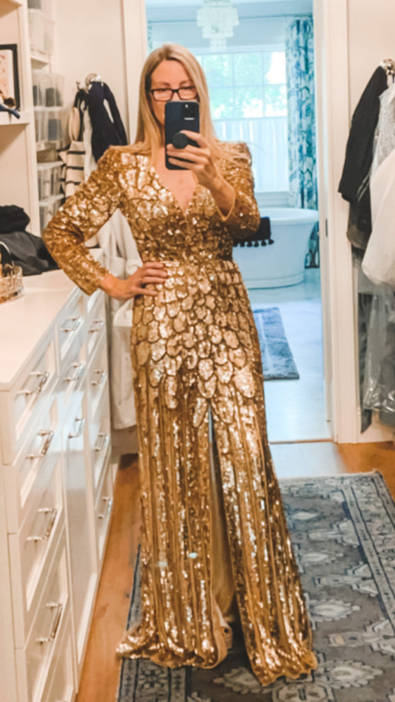 Woman trying on gold sequined gown