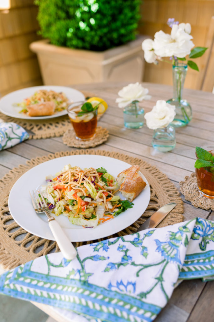Asian Chicken Salad plated on outdoor table