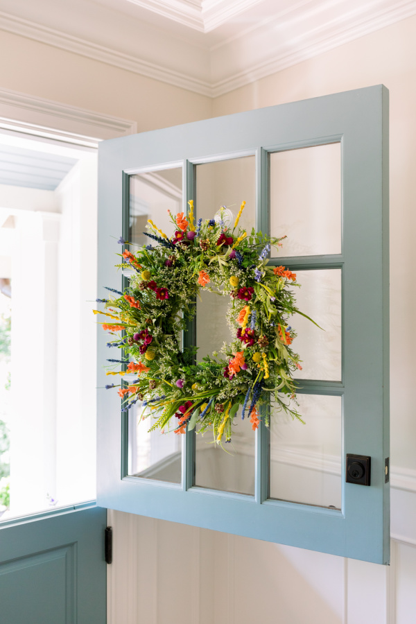Dutch door opened with wreath