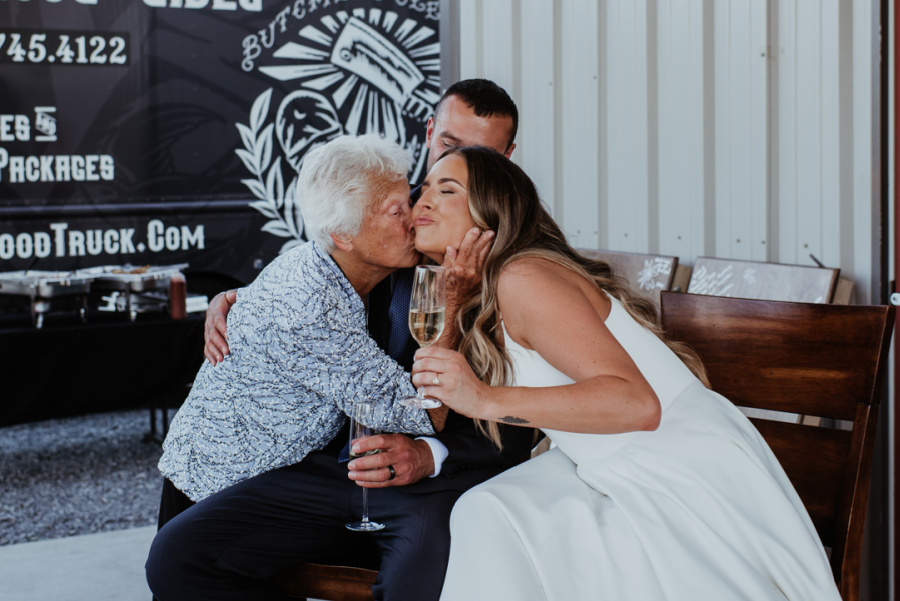 Grandma toasting bride and groom