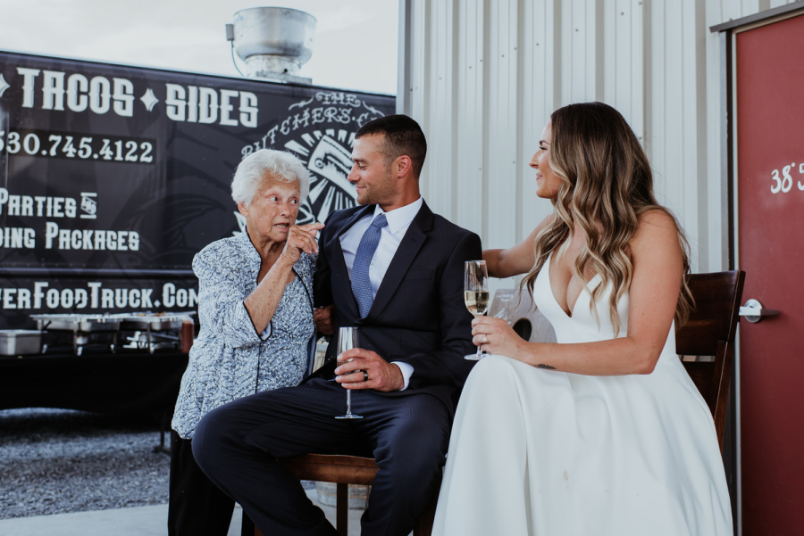 Grandma toasting bride and groom