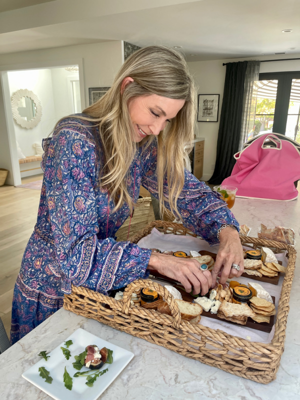 Woman putting appetizer tray together