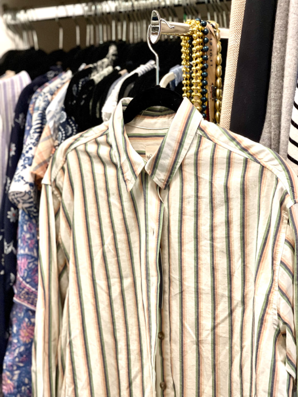Striped shirt from Target hanging in closet.