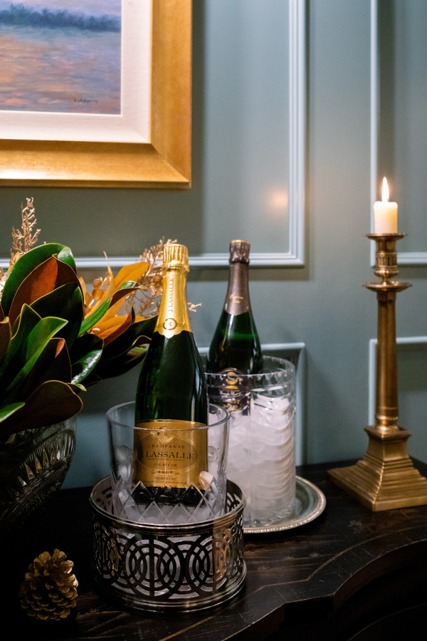 Champagne in iced buckets on sideboard.