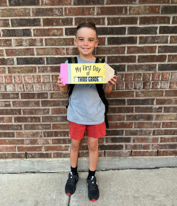 Little boy on first day of 3rd grade.