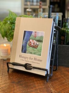Hungry For Home book on counter in book rack.