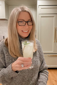 Woman holding glass of lemonade.
