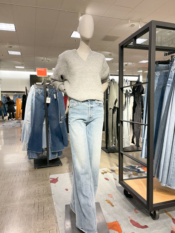 Mannequin at Nordstrom in jeans and grey sweater.