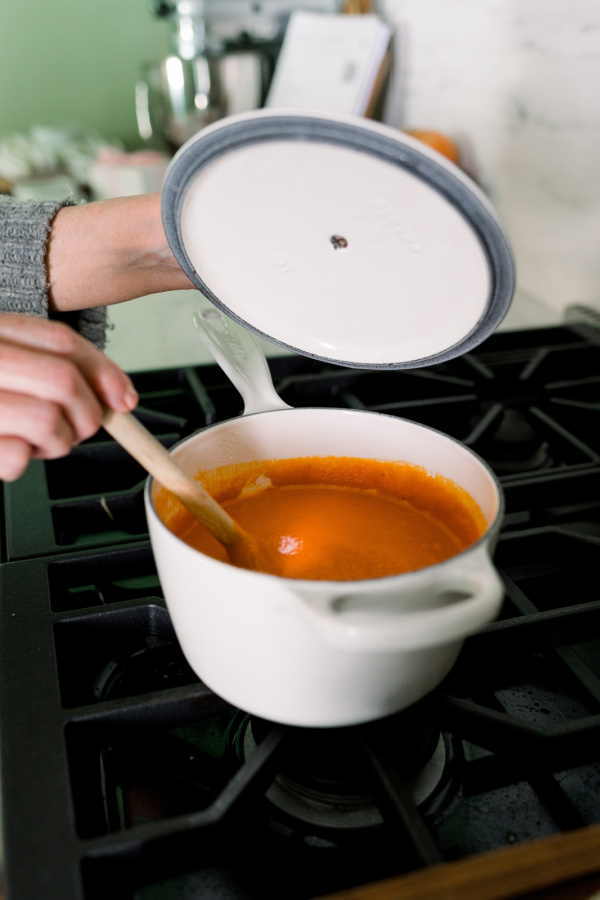 Pot of tomato soup on stove.