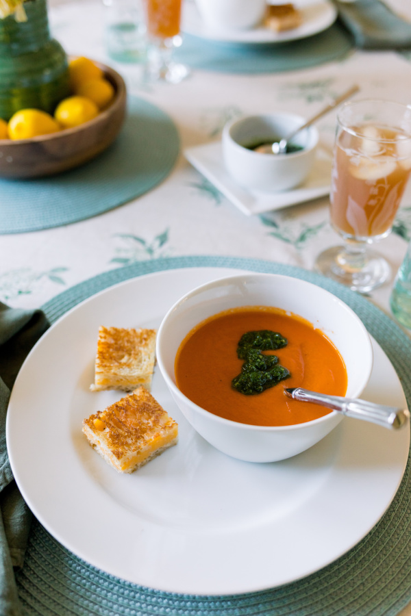 Tomato soup topped with salsa verde and served with grilled cheese bites.