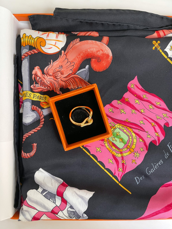 Hermes silk scarf and scarf ring in their boxes.