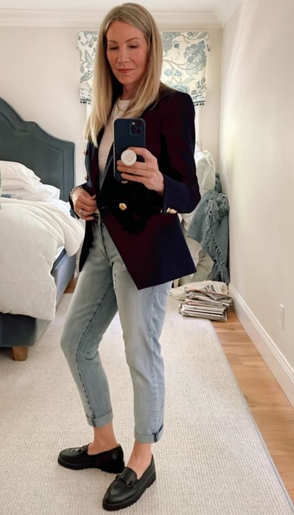 Woman taking mirror selfie wearing Veronica Beard blazer.