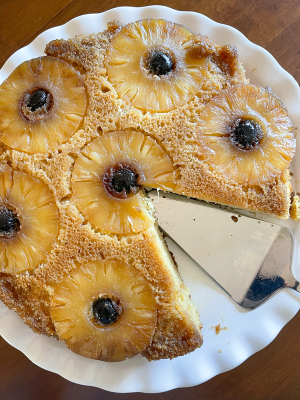 Pineapple Upside Down Cake with one slice missing.