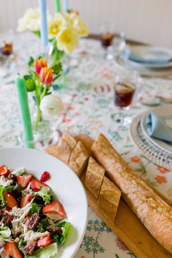 Spring Salad and Baguette on spring table setting.