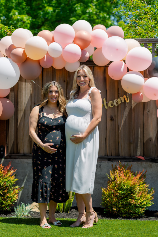 Two pregnant woman at baby shower.