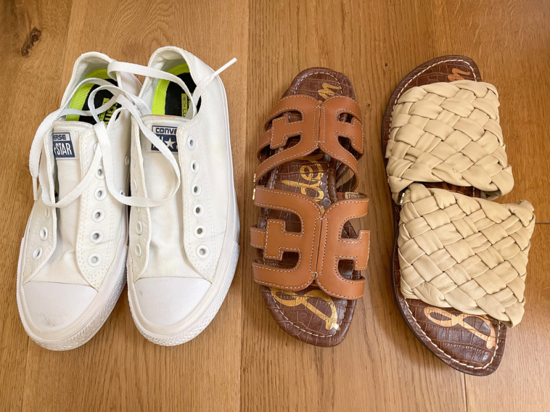 White Keds and two pair of sandals ready to pack.