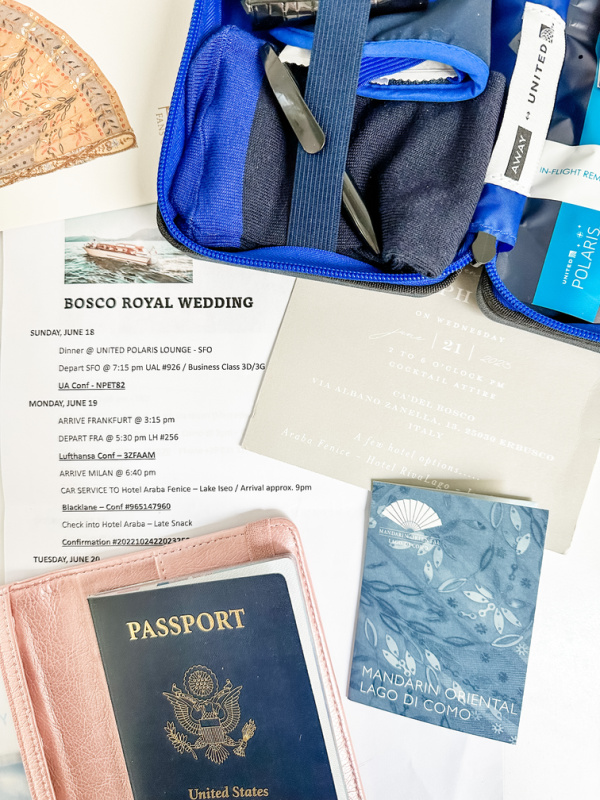 Travel itinerary, passport, room key holder and Polaris amenity kit.
