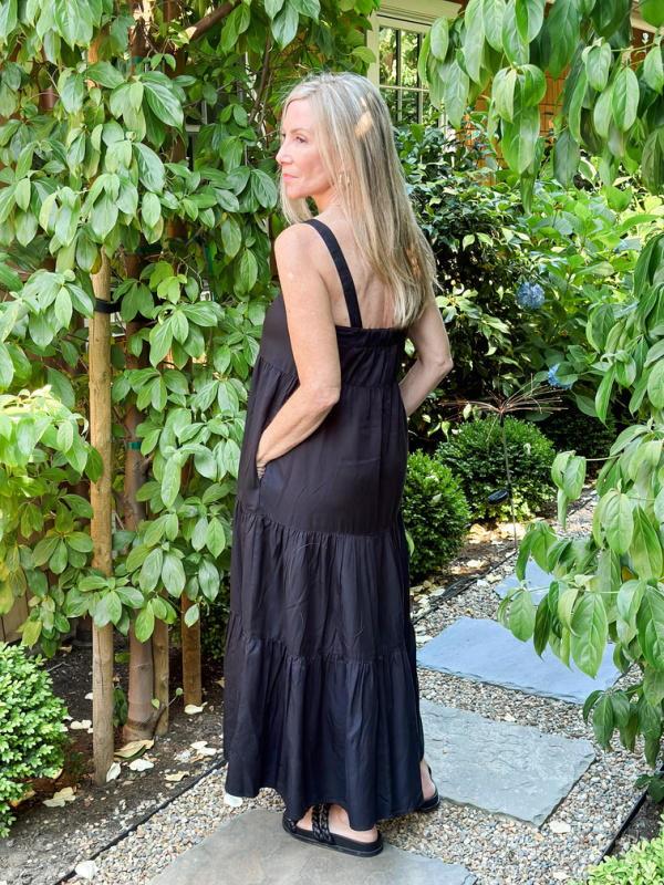 Woman wearing black summer dress.