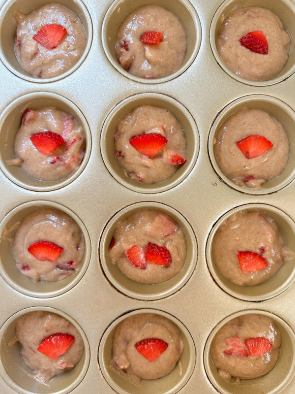 Strawberry Muffin batter in cupcake pan.