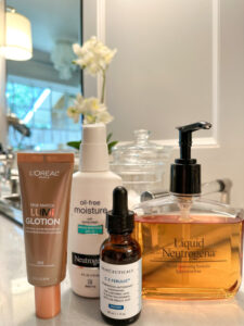 Skincare products on bathroom counter.