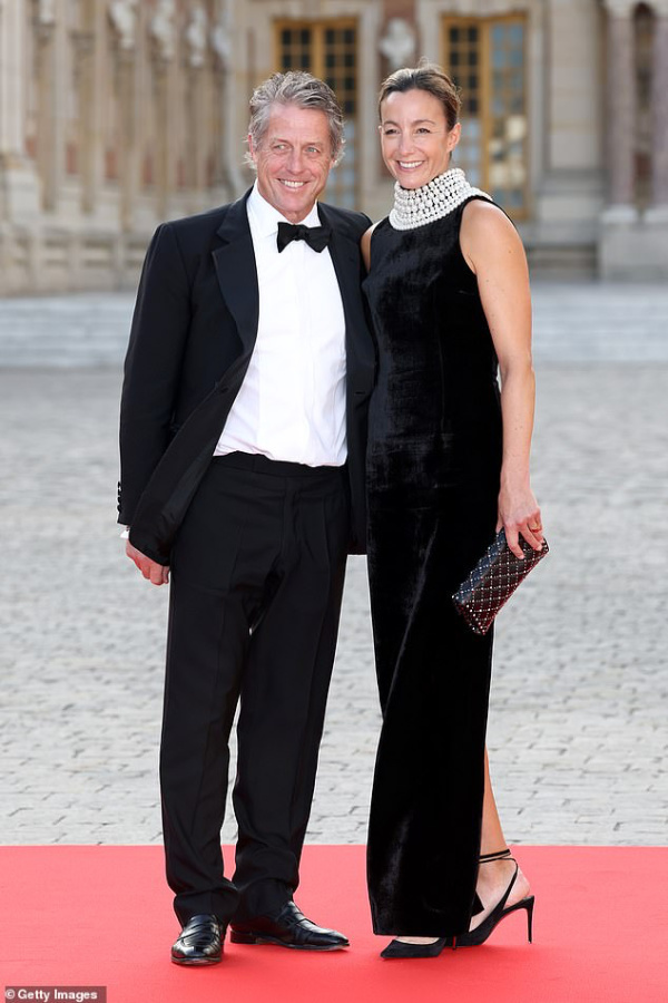 Hugh Grant and his wife at Versatile state dinner.