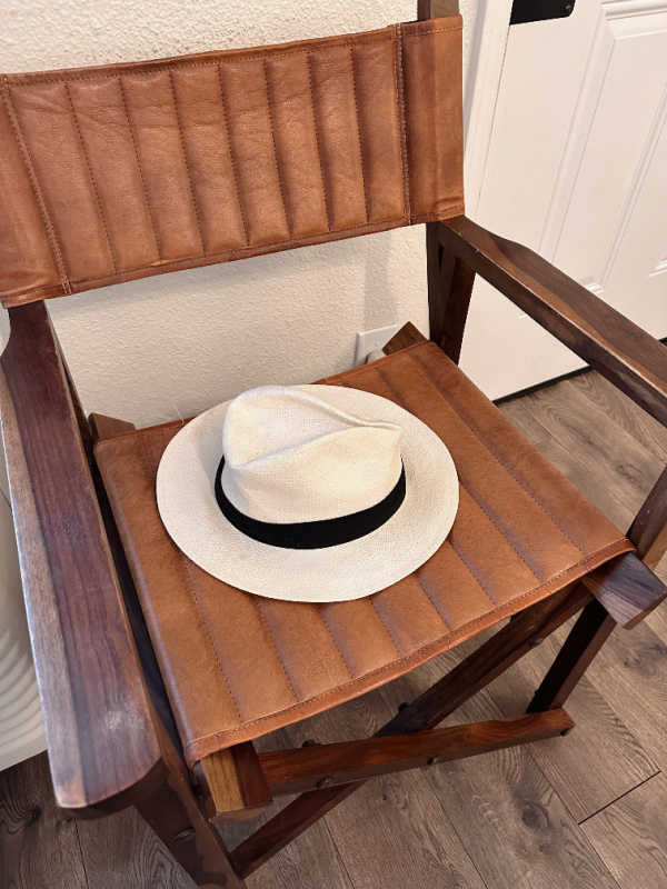 Hat on leather directors chair at Stables Inn.
