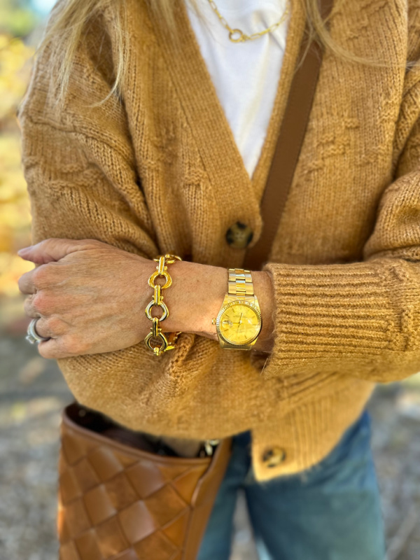 Close up view of a cute cardigan sweater and Banana Republic link bracelet.