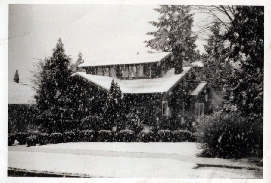 Snow covered traditional house Everett Washington.