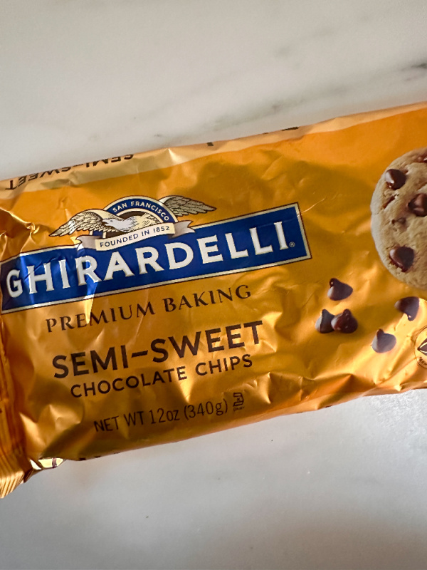 Overhead shot of bag of Ghirardelli chocolate chips.