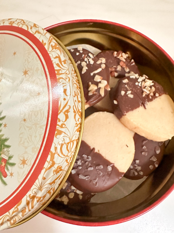 Christmas tin filled with chocolate dipped shortbread cookies.
