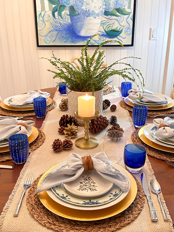 Christmas table setting in blue, white and green.