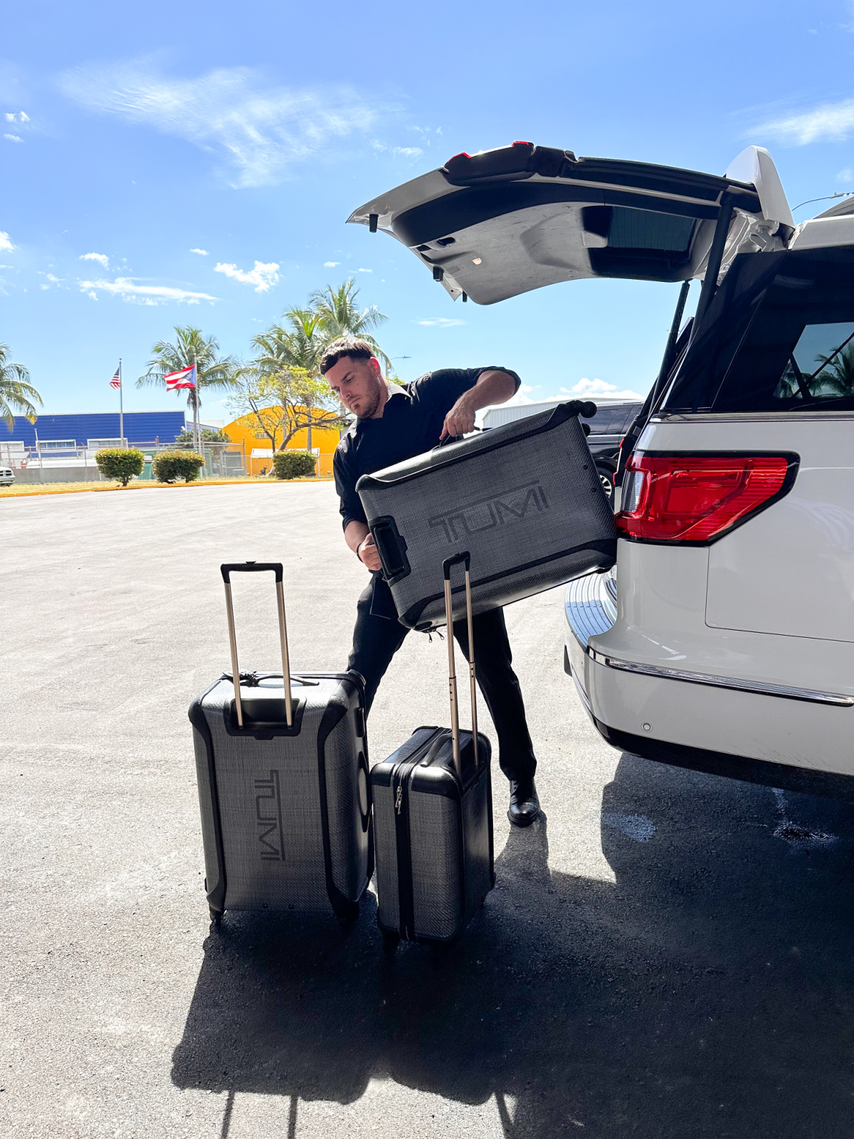 Uber driver unloading luggage in San Juan Puerto Rico.