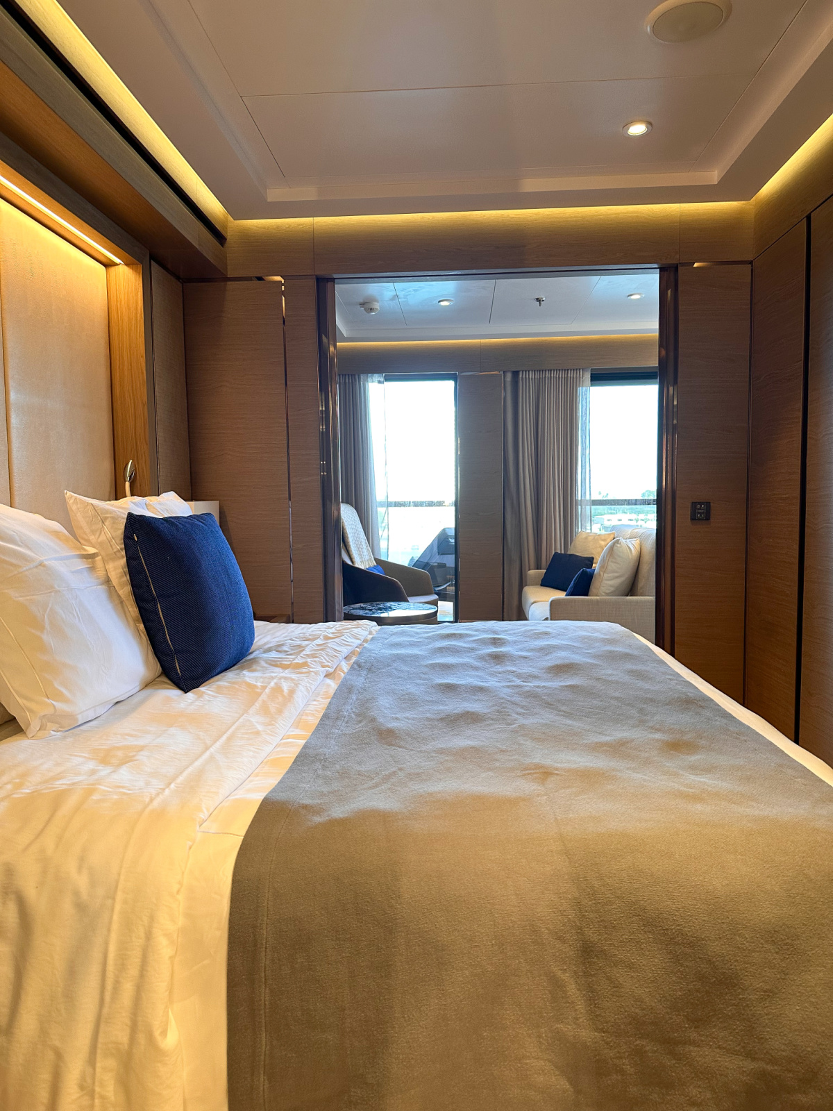 Bedroom of Signature Suite on Evrima yacht.