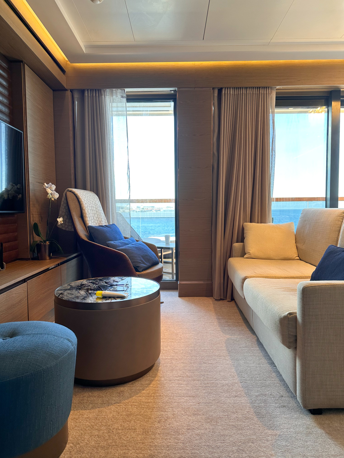 Living area of Signature Suite on Evrima yacht.
