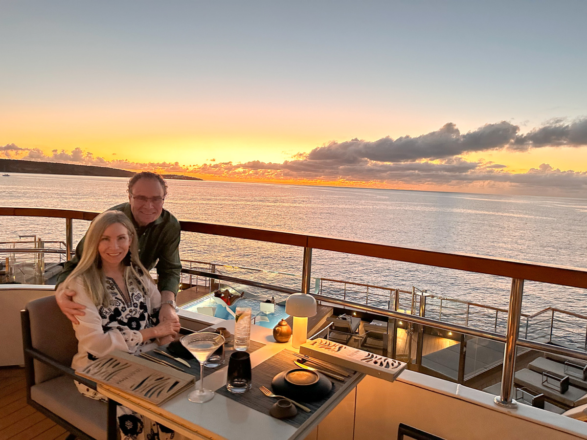 Couple at dinner on RITZ CARLTON Yacht deck.