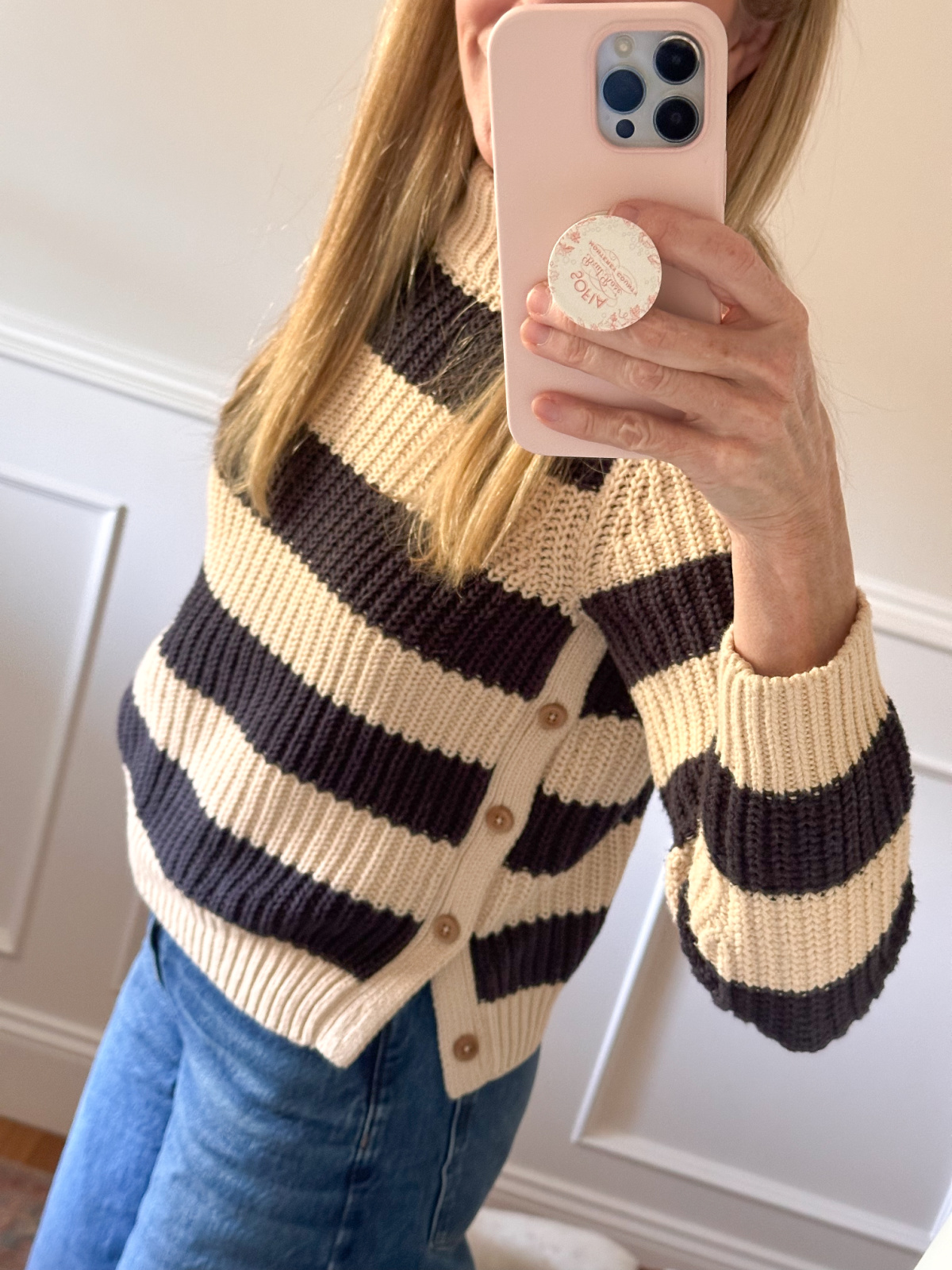 Close up selfie of striped sweater.