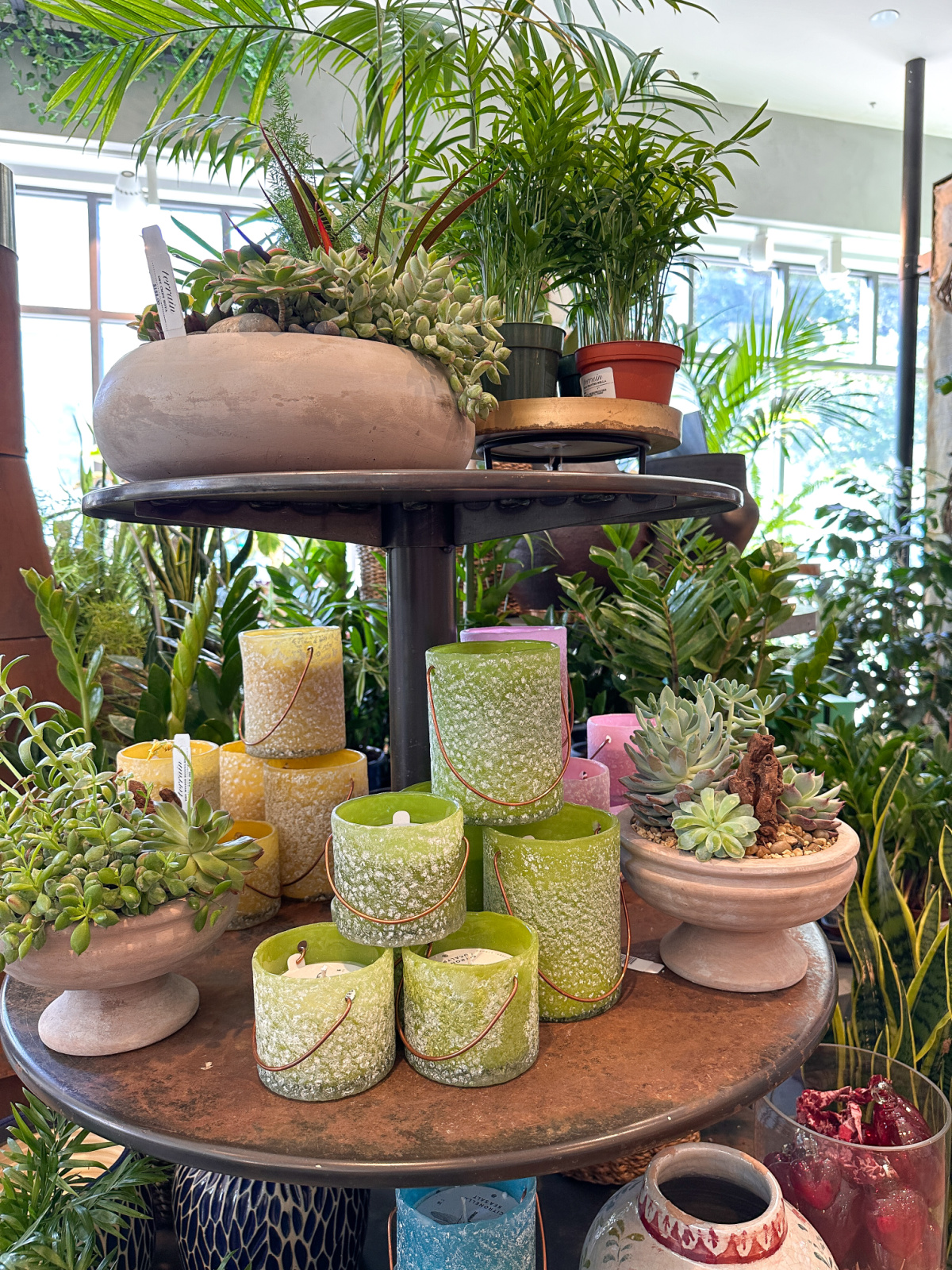 Display of green citronella candles at Terraine.