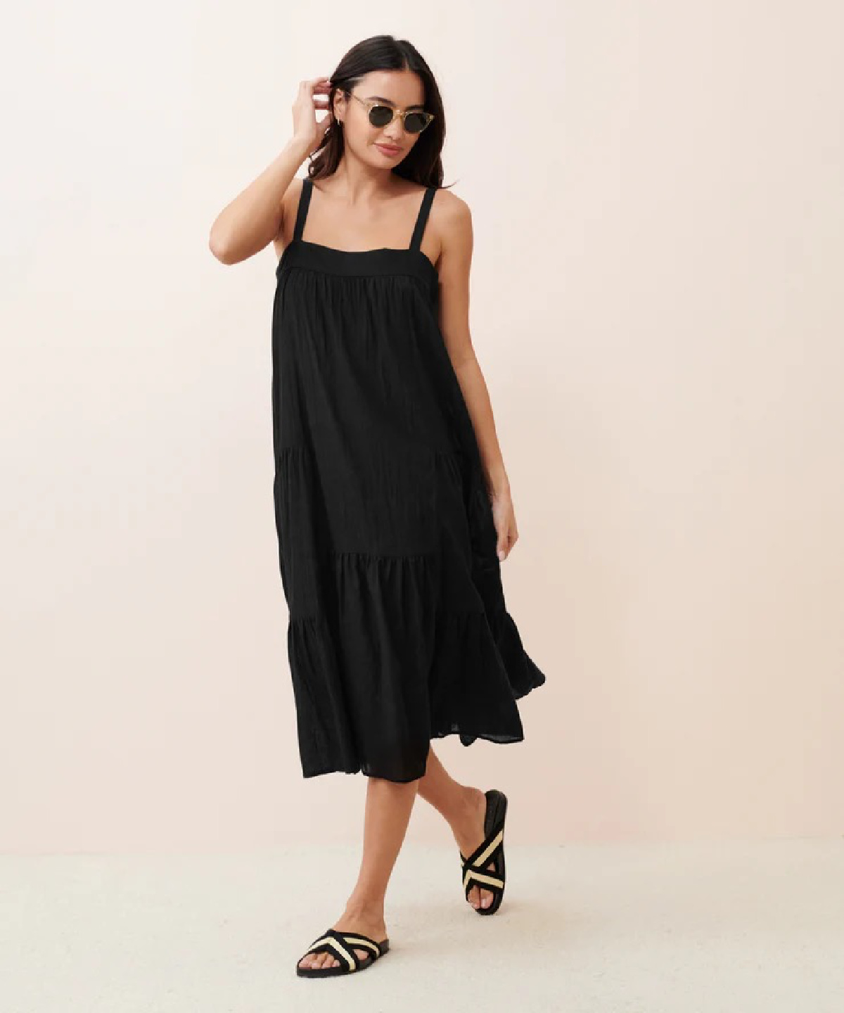 Model wearing Jenni Kayne black summer dress.