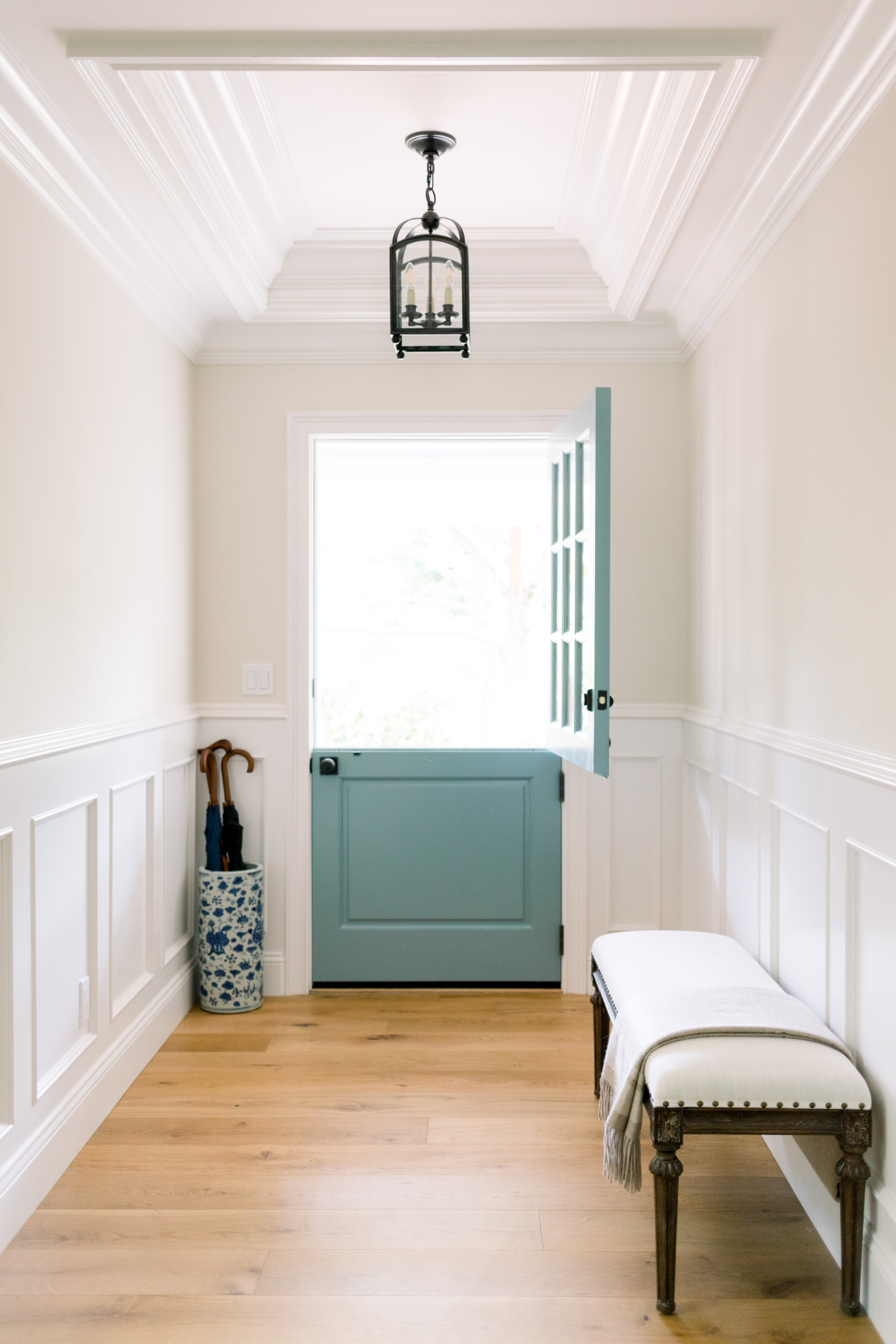 Small entry way with Oval Room Blue Dutch door.