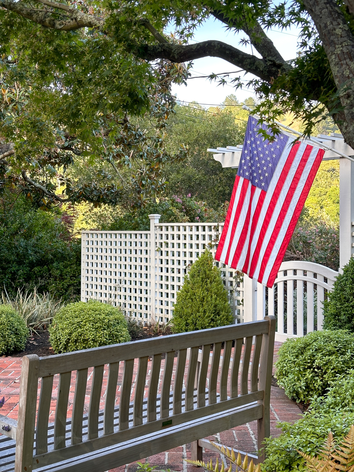 American flag flying outside home.