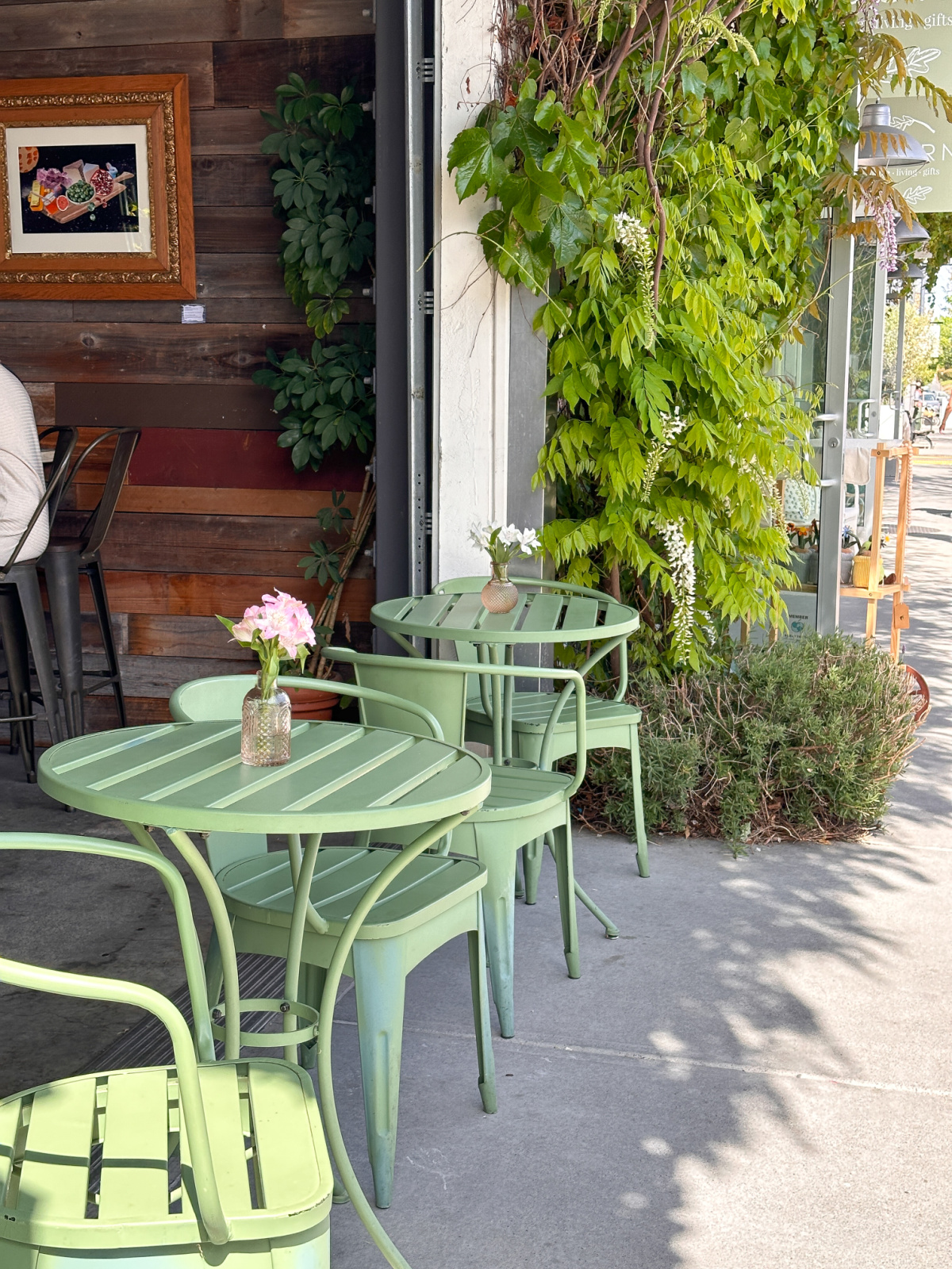 Cute green bistro tables and chairs outside PAX winery.