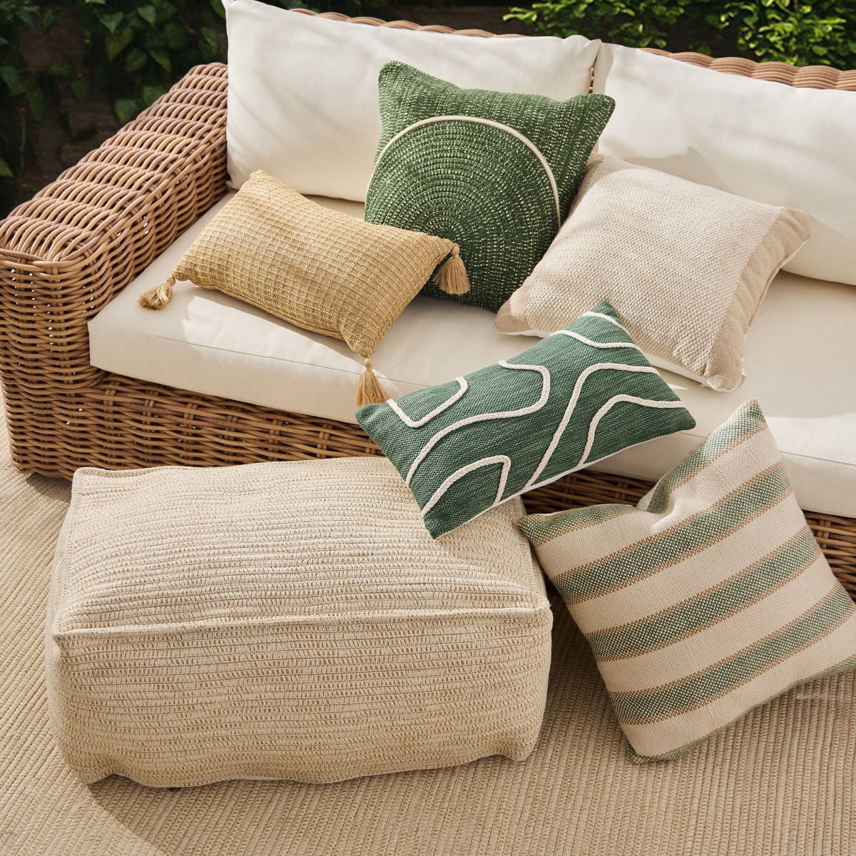 West Elm outdoor pillows in green and natural theme.